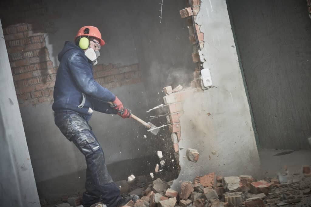 Man Smashing Brick Wall