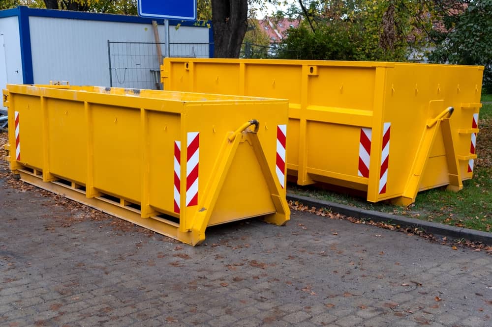 Two,Yellow,Metal,Dumpster,Containers,For,Construction,Garbage,,House,Renovation,