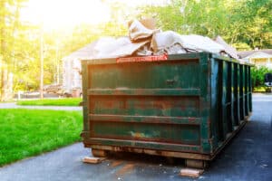 Dumpsters,Being,Full,With,Garbage,In,A,City.,Dumpsters,Being