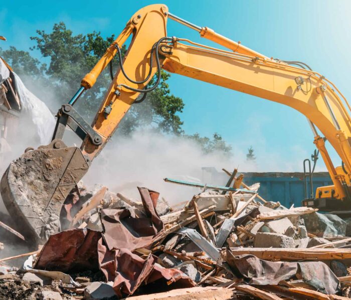 Demolition,Of,Building.,Excavator,Breaks,Old,House.,Freeing,Up,Space